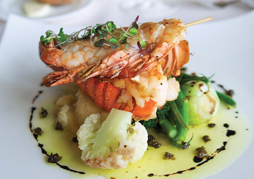 Exquisite Culinary Delights at West Bay Club plate of delicious food at west bay club