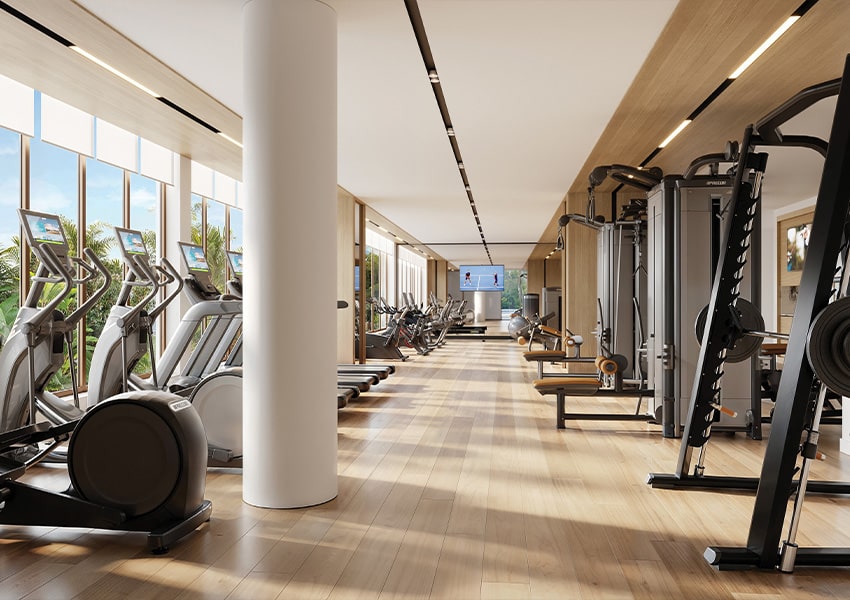Fitness Center Fitness center at Island West Bay with cardio machines, strength equipment, and views of coastal greenery
