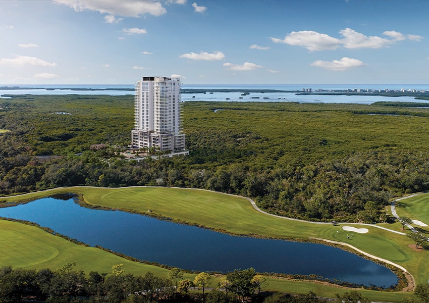 The Island at West Bay Aerial view of Island West Bay tower above Estero Bay with adjacent championship golf course
