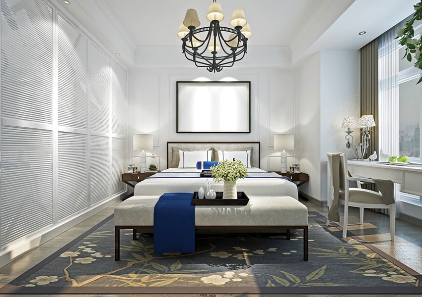 West Bay Club's Guest Suites Bright modern bedroom with elegant furnishings, soft lighting, and large window views at Island West Bay